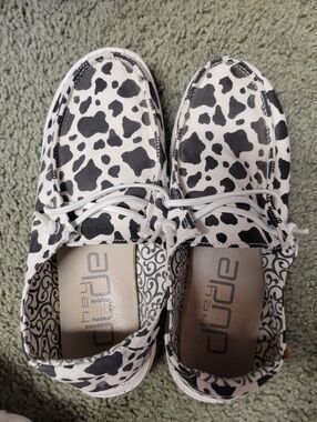 Hey Dude Women's Cow Spot Slip-Ons in Black and White